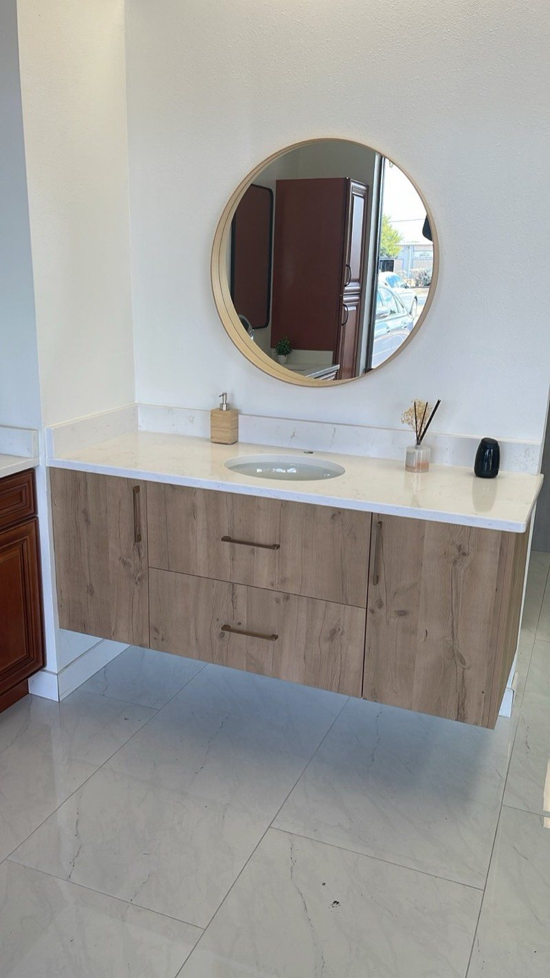 Floating wood-grain bathroom vanity with quartz top and round mirror
