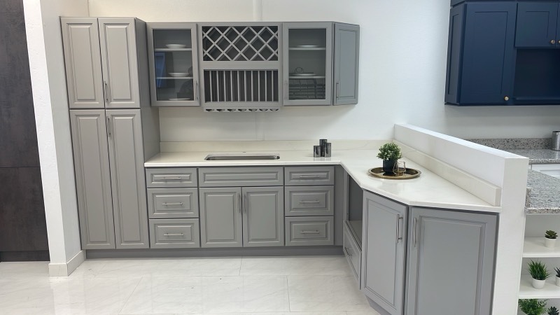 Gray display kitchen with wine rack in the Cabinet Bazaar contractor showroom in San Antonio