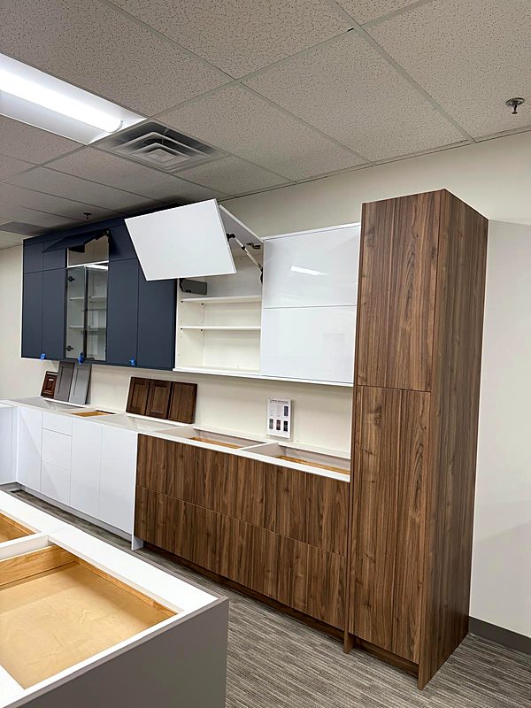 Walnut and white modern flat-panel kitchen cabinets on display
