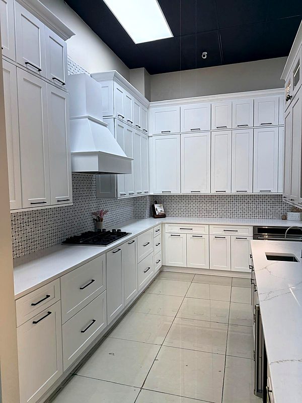 Bright white Shaker kitchen cabinets with quartz countertops in a San Antonio kitchen