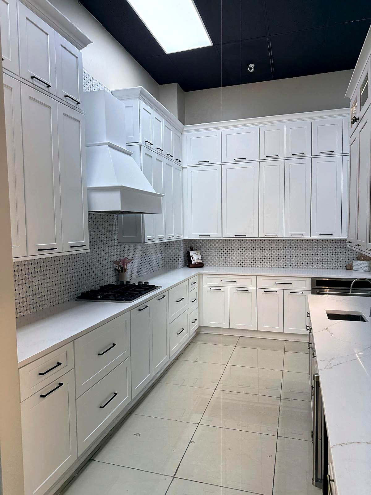 Bright white Shaker kitchen cabinets with quartz countertops in a San Antonio kitchen